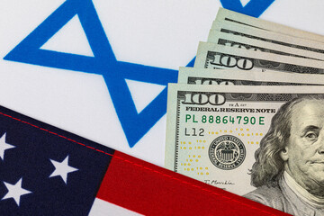 United States of America and Israel flags with cash money. Government relations, foreign aid and funding concept.