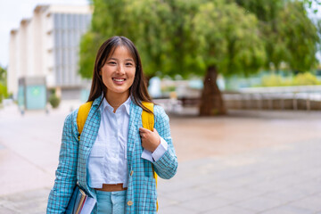 Smiling asian woman in the university campus