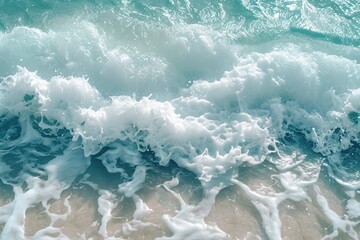 Beautiful natural texture of rolling sea waves surf with white foam and clear water with turquoise and green hueshigh