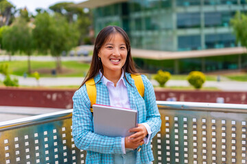Cheerful asian student smiling standing in the university campus