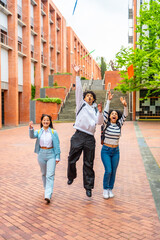 Fototapeta premium Students throwing folders celebrating the end of the course