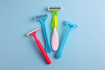 razors for removing unwanted body hair on a bright background. Home hair removal method