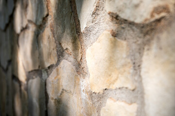 Exterior. Decorative masonry wall. Light stone texture background