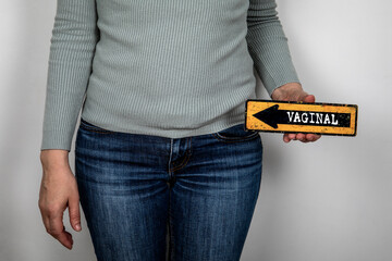 Vaginal. Pointing arrow with text. Women's health and wellness concept