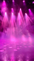 A pink stage with lights and smoke. The stage is set for a performance