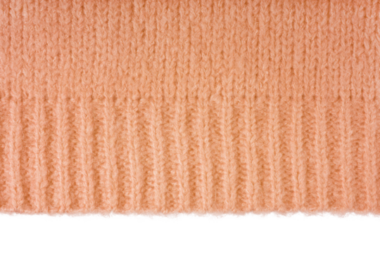 Orange knitted woolen jersey fabric, sweater, pullover texture with edge isolated on white, transparent background. Fabric abstract backdrop, cloth wallpaper