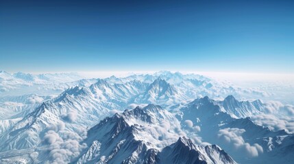 Obraz premium A panoramic view of snow-covered peaks stretching into the distance, under a clear blue sky.