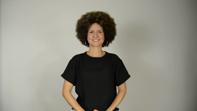 Female interpreter says the phrase hands make communication in Brazilian sign language.