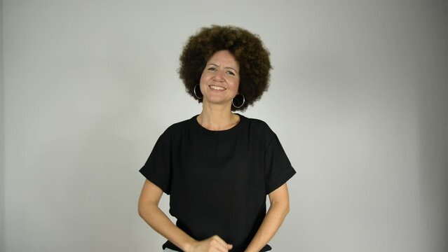 Female interpreter saying good morning in Brazilian sign language.