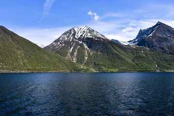 Norwegian Fjords. hj&oslash;rundfjord. Sunny day in snowy mountains. 