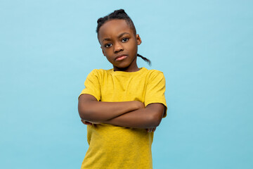 African american boy in yellow tshirt looking moody