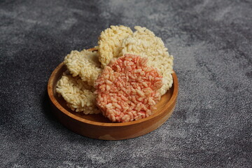 Rengginang is a typical Indonesian snack made from glutinous rice grains that are seasoned and...