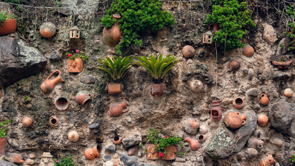 Obraz premium wall background with plants and ceramics embedded in it
