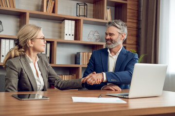 Supporting coworkers in therapy sessions man and woman psychologists collaborating