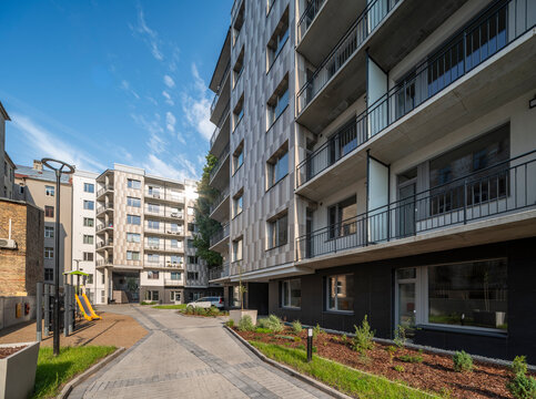 Courtyard and fasade of a modern residential house in a European city.