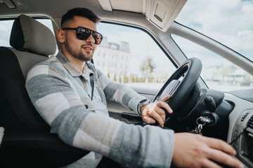 A well-dressed man with sunglasses drives, exuding confidence and style behind the wheel in a...