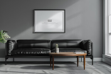 Minimalist interior with a black leather sofa and a walnut coffee table under a framed mockup on a gray wall.