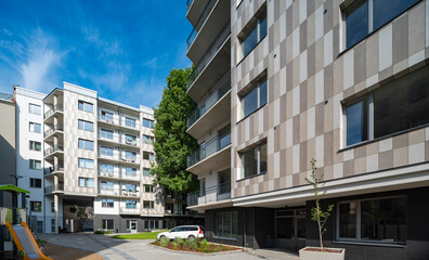Fototapeta premium Courtyard and fasade of a modern residential house in a European city.