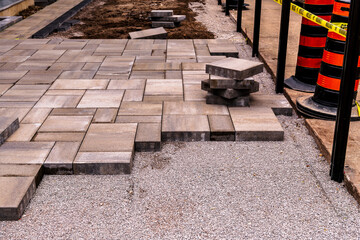home construction: patio and walkway paving stone instalation in progress at a new house build in...