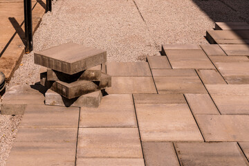 home construction: patio and walkway paving stone instalation in progress at a new house build in...