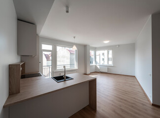The interior of an apartment in a modern residential building in a European city.
