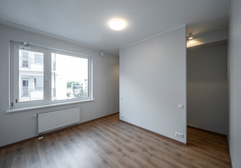 The interior of an apartment in a modern residential building in a European city.