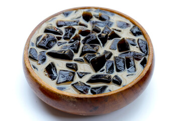 Grass jelly in milk with brown sugar, herbal dessert. Mesona chinensis