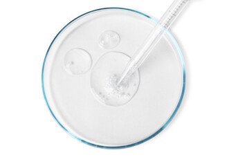 Glass pipette and petri dish with liquid on white background, top view