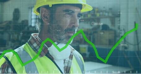 Image of green graph processing over caucasian male carpenter putting on hard hat in workshop
