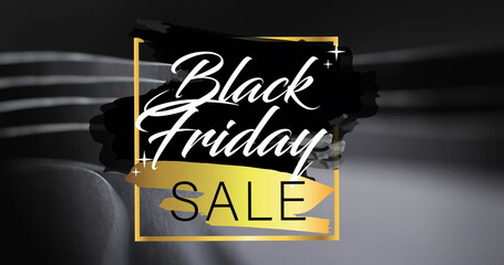 Image of black friday sale text over rolled up black paper on black background