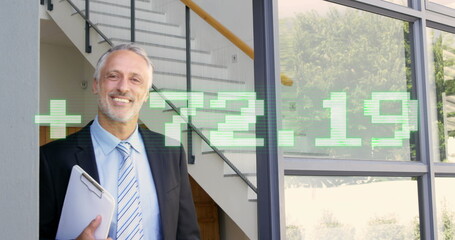 Fototapeta premium Image of stock market data processing against caucasian businessman welcoming at office