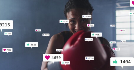 Image of notification bars over diverse female boxer looking at screen and practicing punches