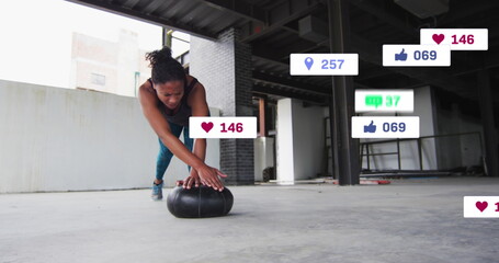 Image of multiple notification bars over african american woman doing push ups in gym