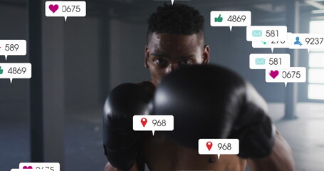 Image of falling notification bars over african american boxer practicing punches