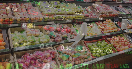 Image of numbers changing and moving over fresh fruits in crates arranged in supermarket