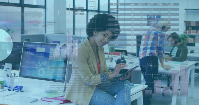 Image of statistical data processing over african american woman using digital tablet at office