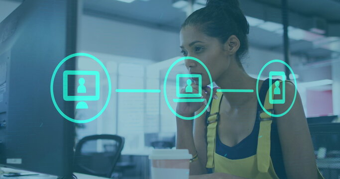 Image of statistical data processing against biracial woman using a computer at office