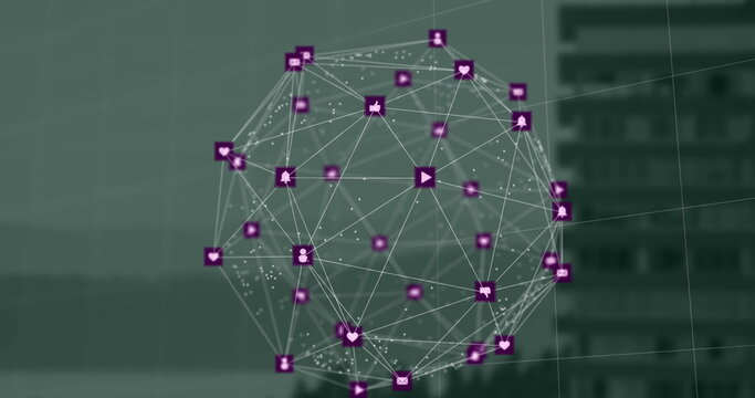 Image of globe of digital icons spinning against aerial view of tall building