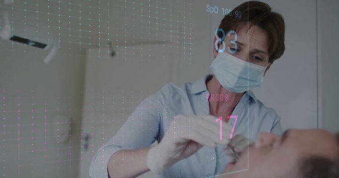 Image of heart rate monitor over caucasian female dentist examining teeth of male patient - Powered by Adobe