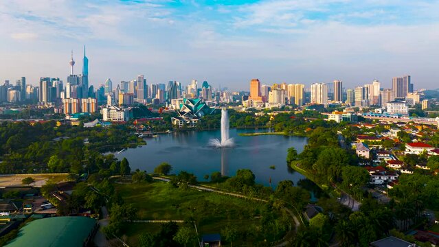 Aerial Hyperlapse of Kuala lumpur city with lake view overseeing Kuala lumpur city during sunrise