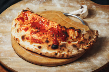 Rustic Calzone on a Wooden Board