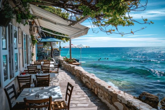 A charming seaside cafe with tables overlooking the ocean