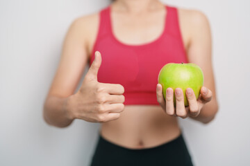 woman hand hold green Apple, happy female fitness choose fruit is Healthy food. Dieting control,...