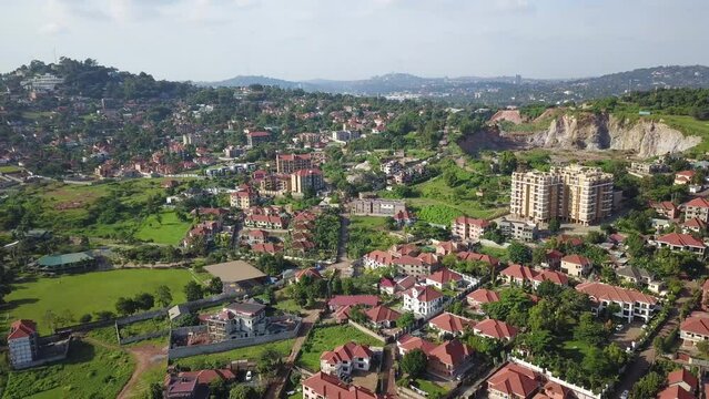 Beautiful drone cityscape of Kampala, Bukasa with stone quarry and middle class residential buildings.