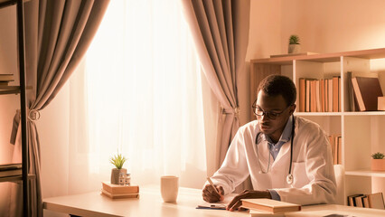 Doctor occupation. Medical paperwork. Healthcare practice. Male physician working writing record at...