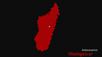 Obraz premium A map of Madagascar, with a dark background and the country's outline in the shape of a colored hexagon, centered around the capital. A simple sketch of the country