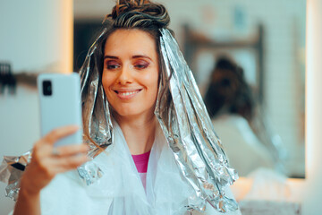 
Hair Salon Client Taking a Selfie with Foils in her Hair 
Funny woman having a sense of humor...
