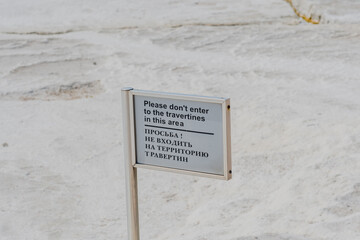 Pamukkale, Turkiye; September 7, 2023:A multilingual warning sign asking visitors not to enter the...