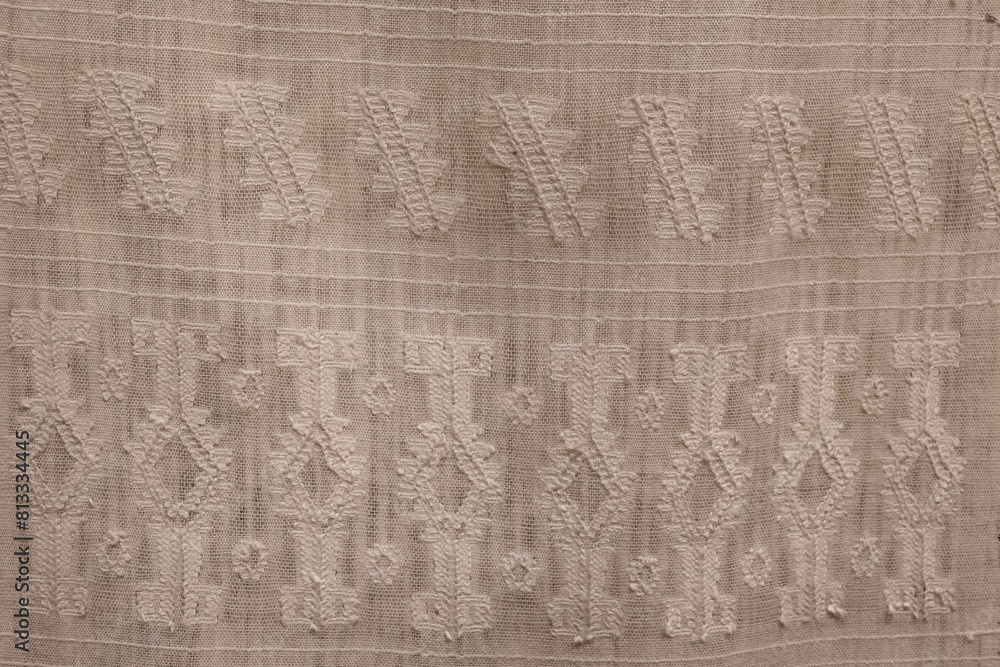 Poster a piece of cloth with a pattern of squares and triangles