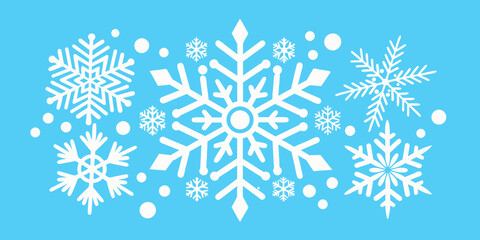 white snowflakes on a blue background close-up